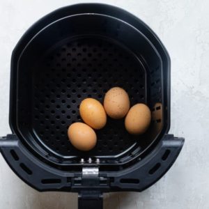 Add the eggs to the fryer basket Add the eggs to the fryer basket
