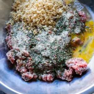 Combine all ingredients in a large bowl and use hands to mix until combined. Combine all ingredients in a large bowl and use hands to mix until combined.