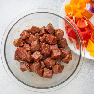 Combine steak and ingredients for the marinade and mix well