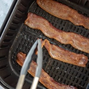 Halfway through, turn the bacon.