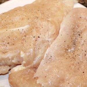 Season chicken with salt and pepper Season chicken with salt and pepper
