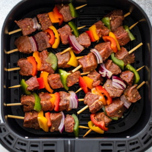 Set the prepared kebabs into the air fryer basket.