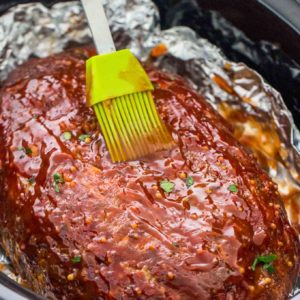Spread half of the sauce over meatloaf Spread half of the sauce over meatloaf