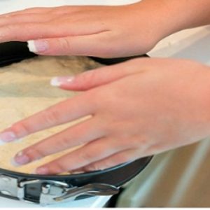 Transfer pizza dough to basket of air fryer.