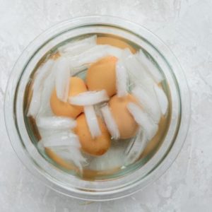 place the hard boiled eggs in an ice water bowl for a minute to make it easy to peel. place the hard boiled eggs in an ice water bowl for a minute to make it easy to peel.