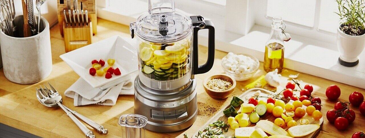 What is the function of a food processor?