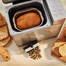 How does the fruit dispenser work on bread machine?